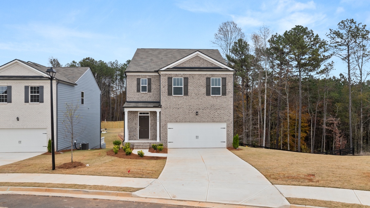 Exterior two-story home with stone detailing