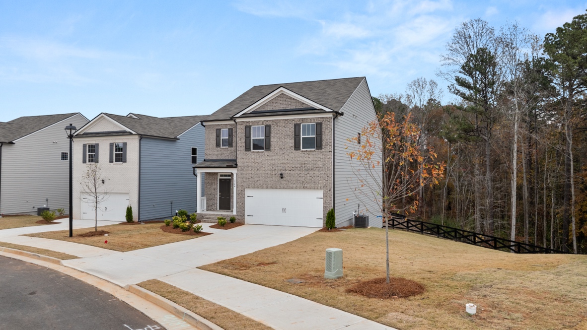 Exterior two-story home with stone detailing