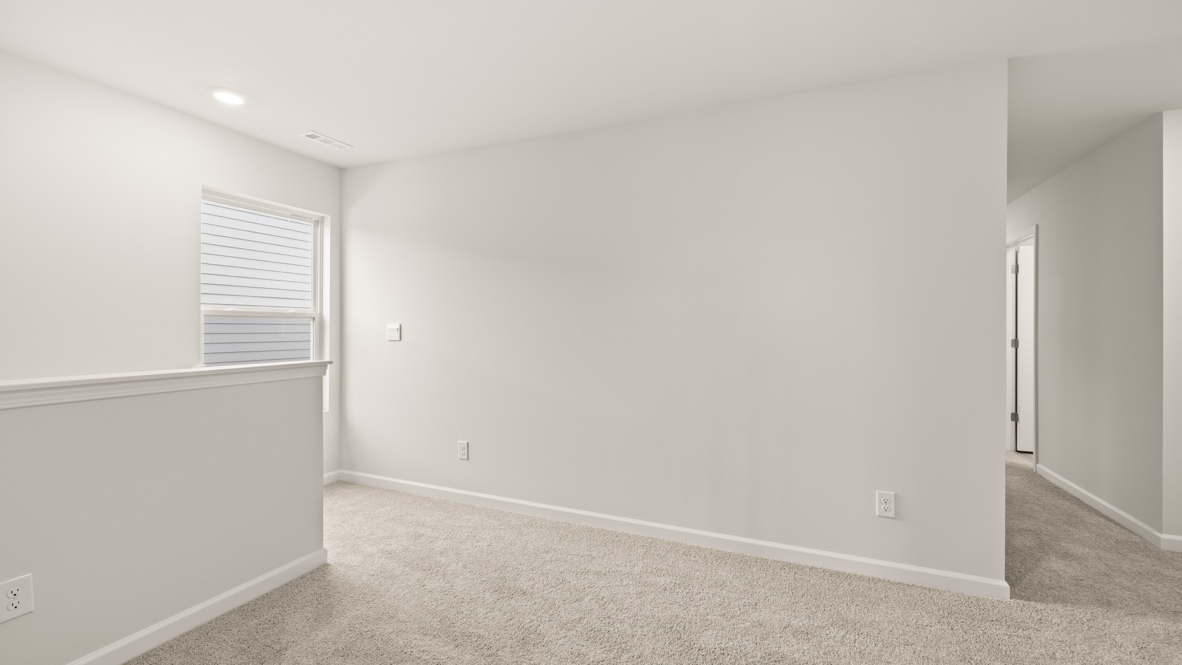 Interior upstairs loft area open to staircase