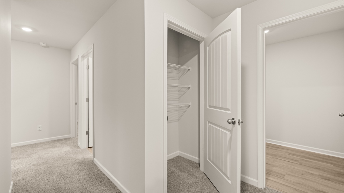 Interior upstairs hallway with hall closet