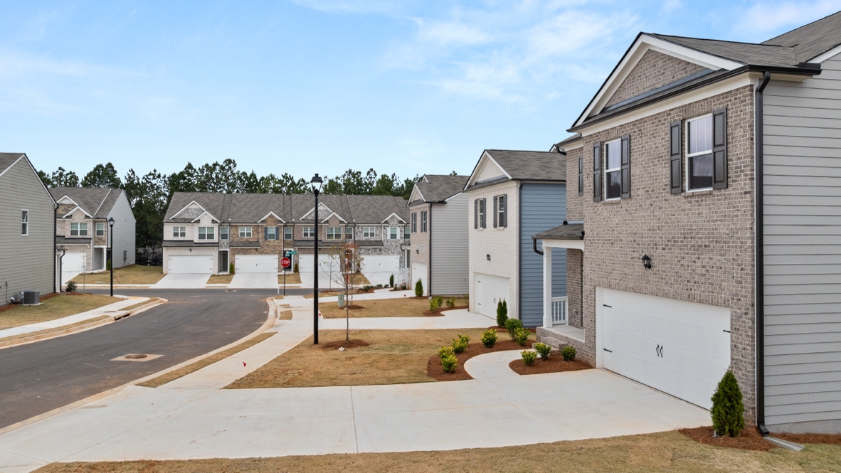Exterior two-story home with stone detailing