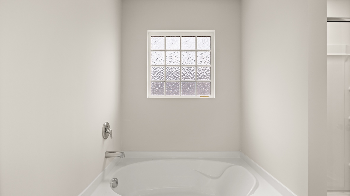 Interior primary bathroom with bath tub