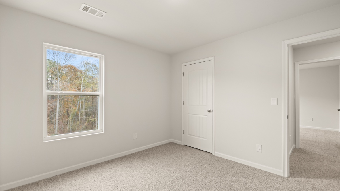Interior bedroom with window and closet