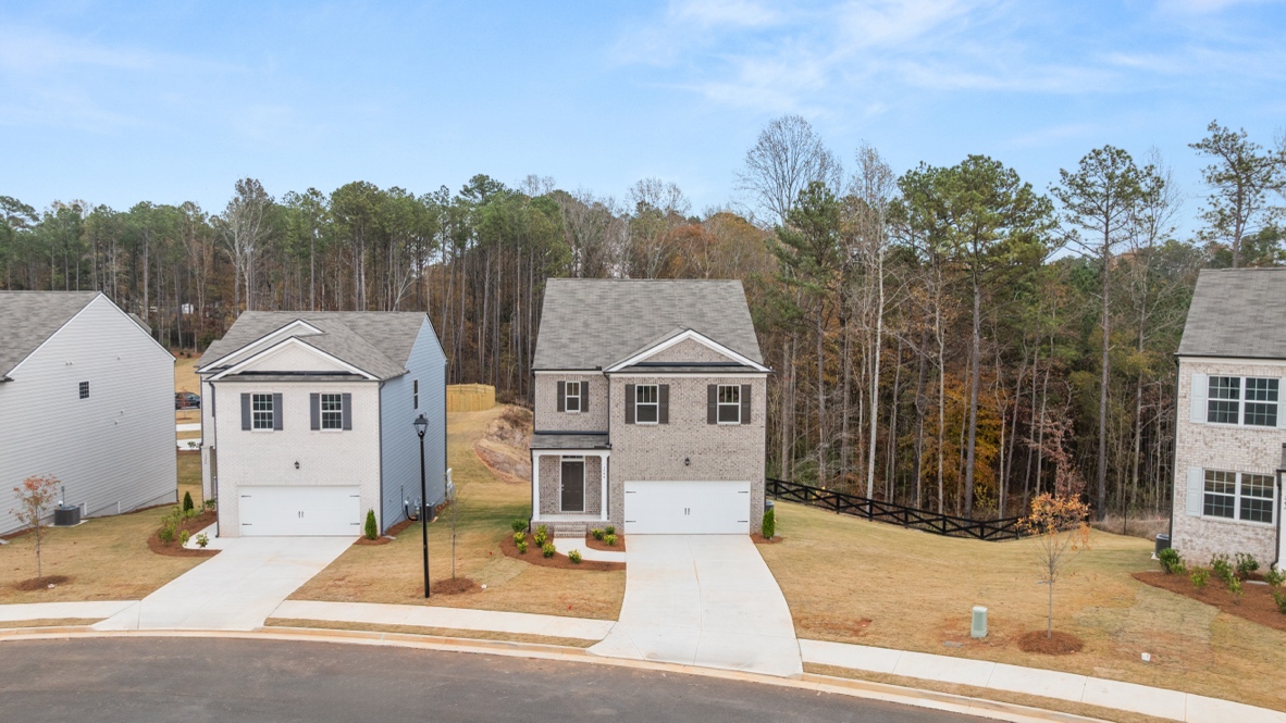 Exterior two-story homes with stone detailing