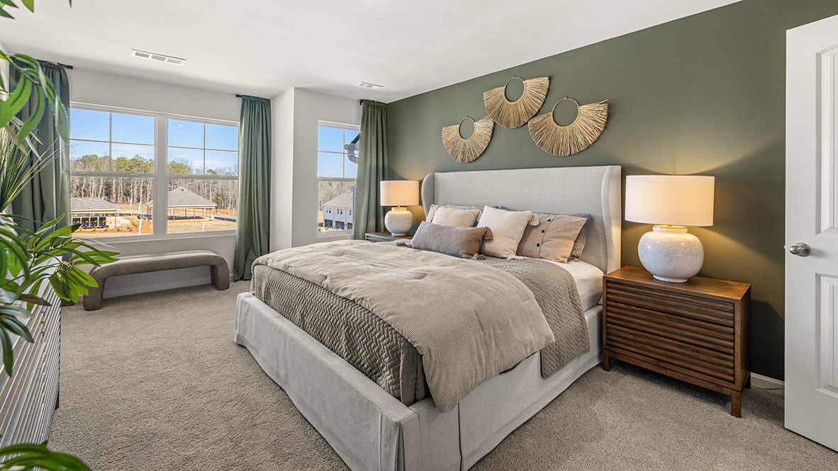Interior bedroom with large windows and accent wall
