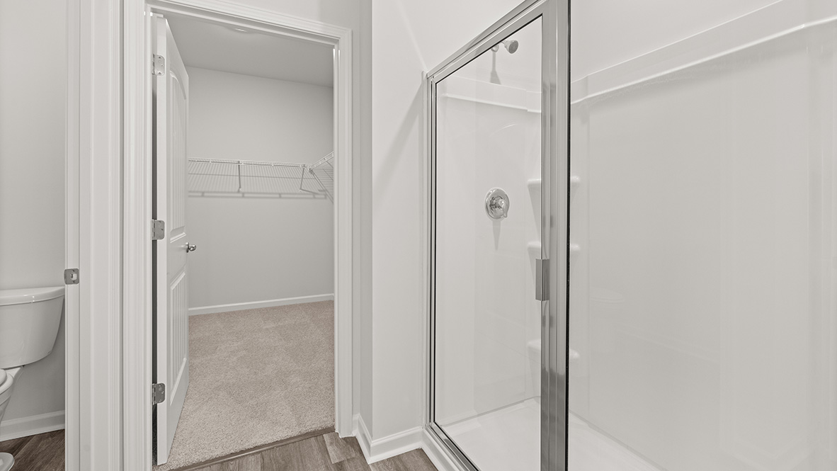 bathroom with a vanity sink, toilet and shower