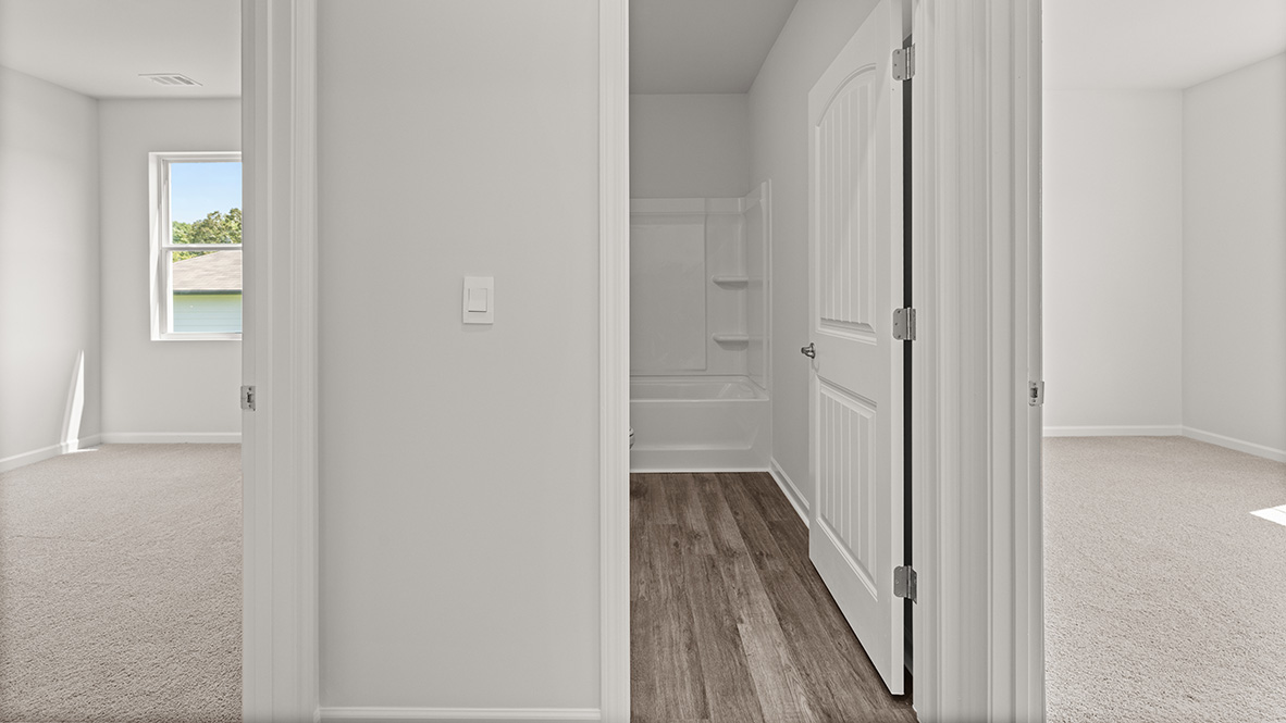 hallway view overlooking the bathroom and bedrooms
