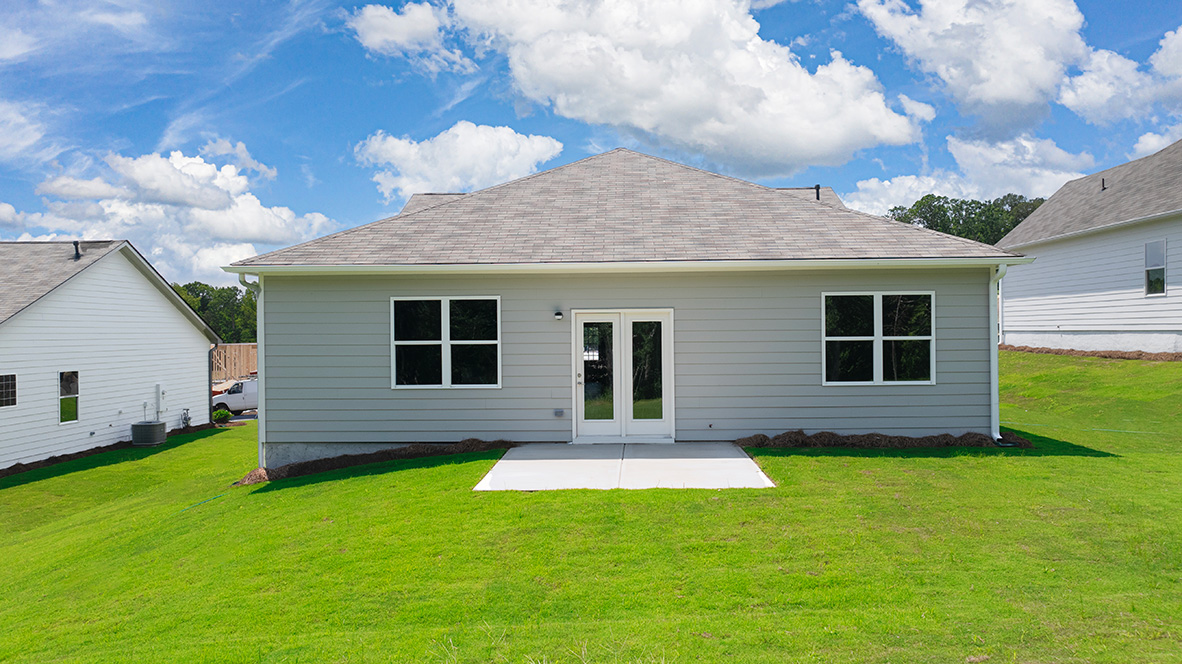 rear exterior of home featuring a concrete patio