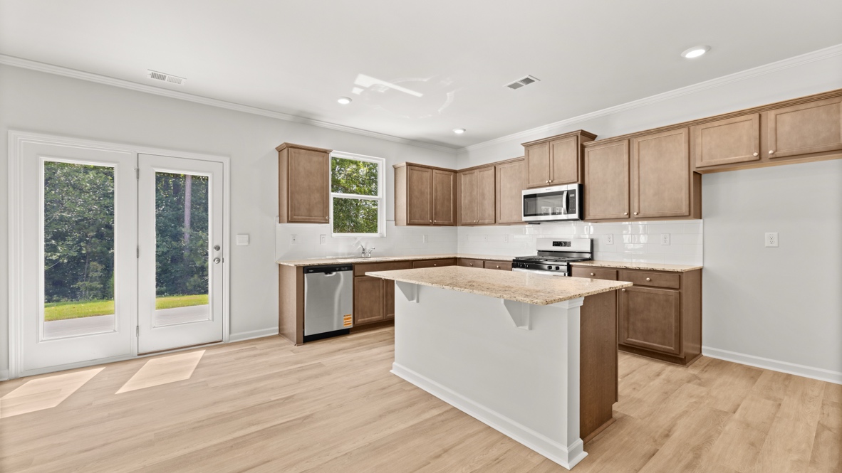 Interior kitchen with center island and wooden cabinets
