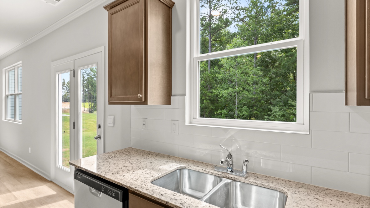 Interior kitchen with center island and wooden cabinets