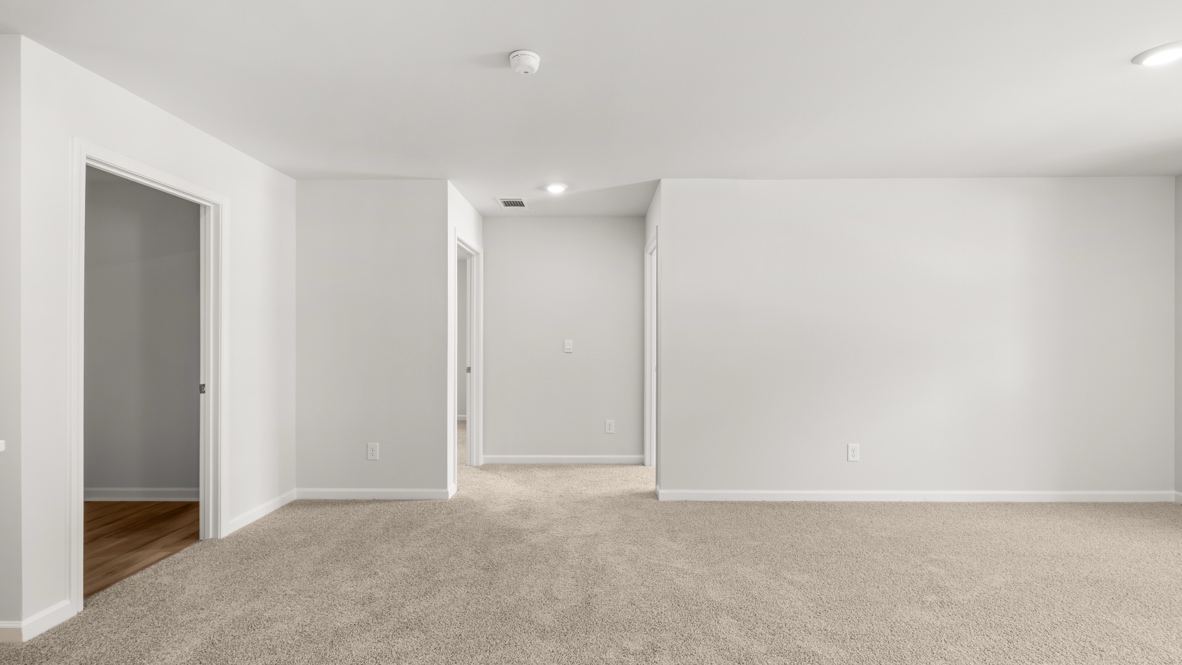 Interior upstairs loft area open to staircase