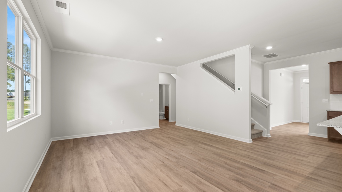 Open concept first floor with the living room, dining room and kitchen next to each other