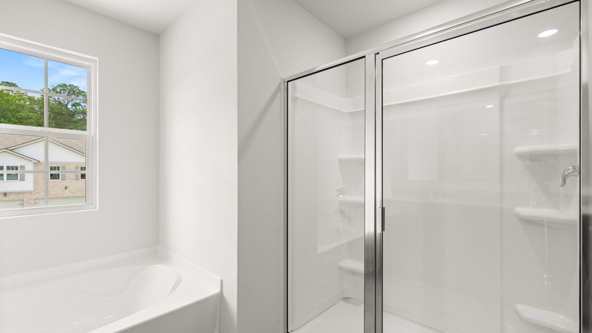 bathroom with a vanity sink, toilet and shower