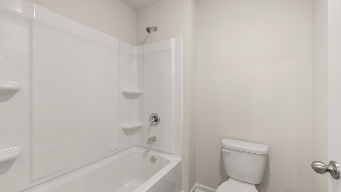 bathroom with a vanity sink, toilet and shower