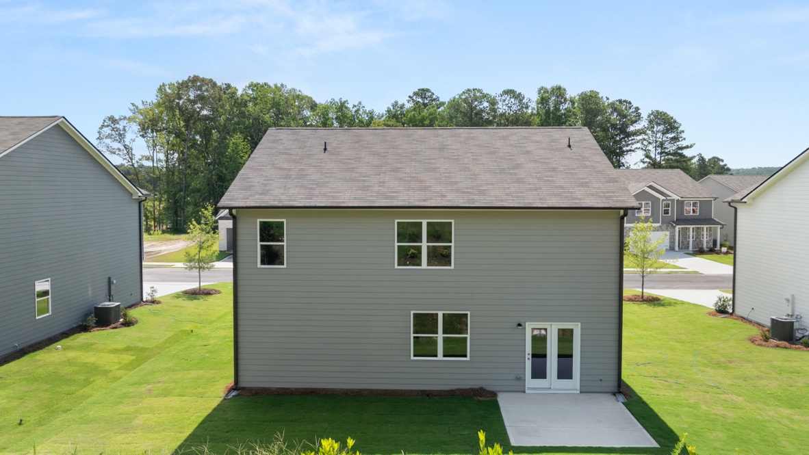 rear exterior of home featuring a concrete patio