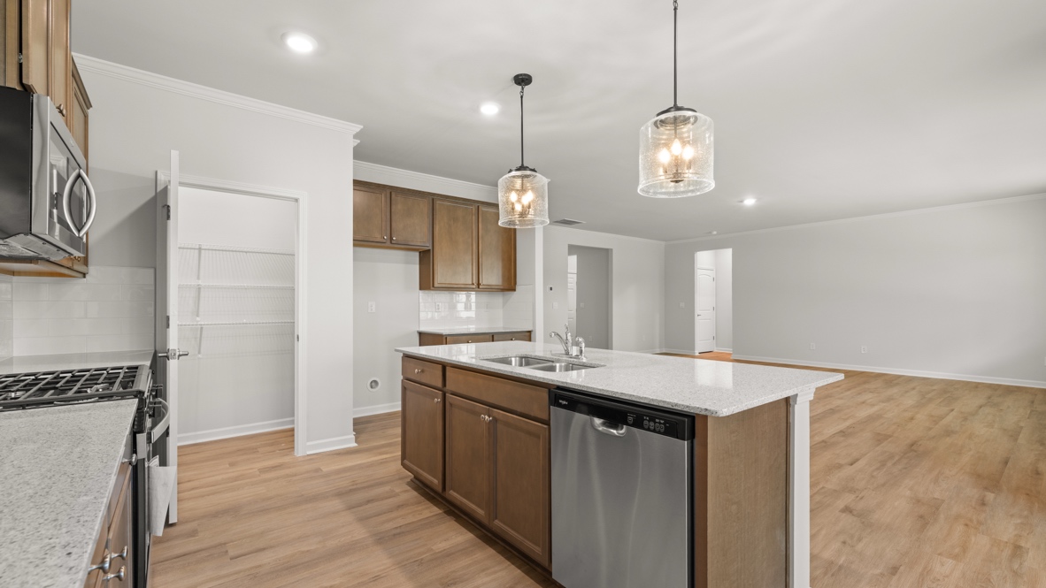 Interior kitchen with center island and wooden cabinets