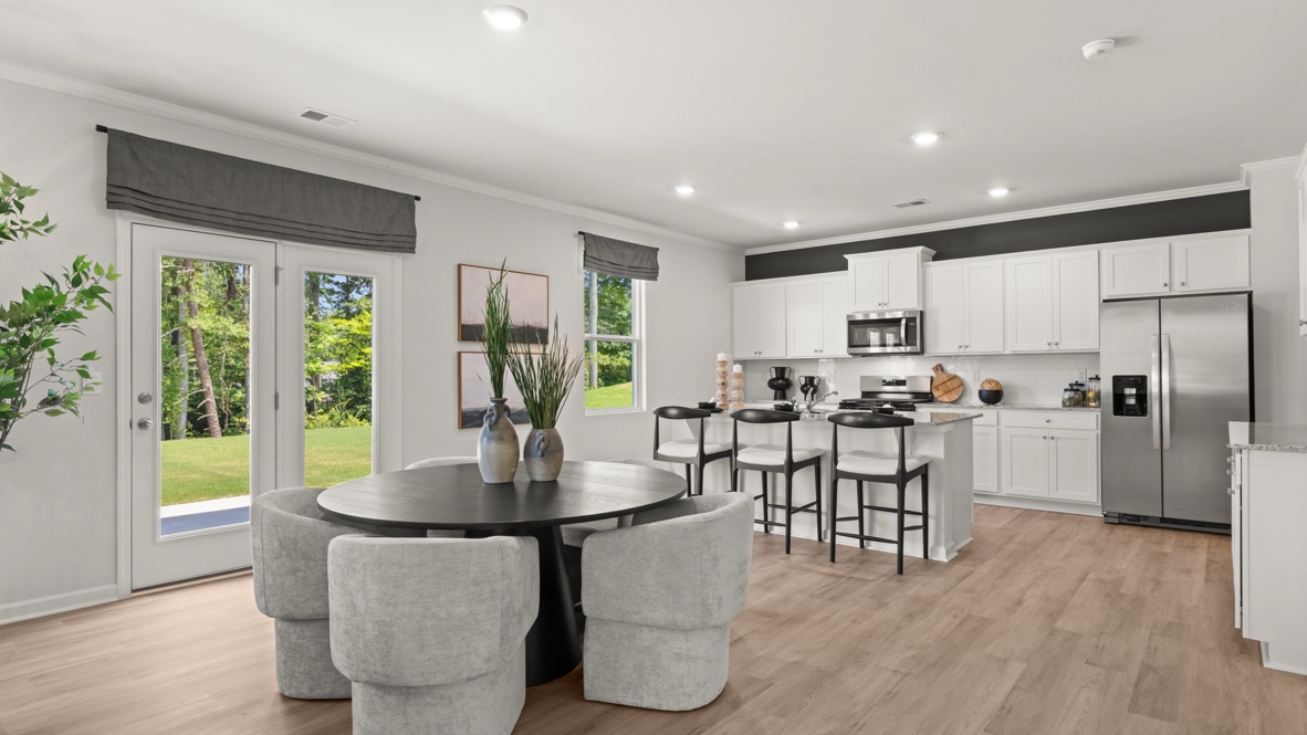 Interior dining area open to kitchen with center island