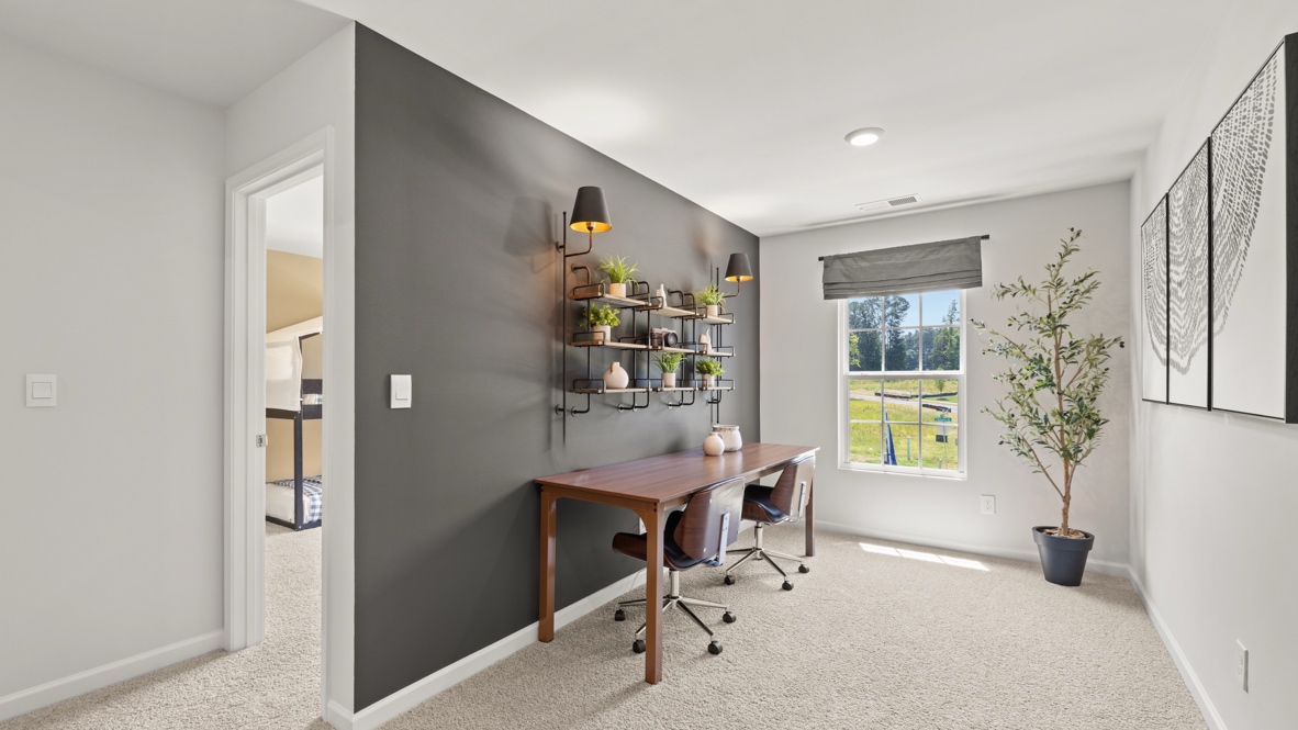 Interior upstairs loft area with dark grey accent wall