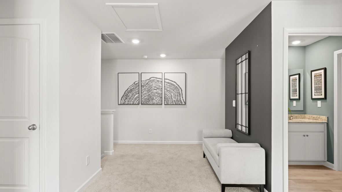 Interior upstairs loft area with dark grey accent wall