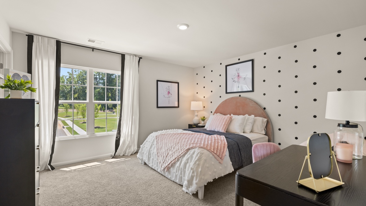 Interior bedroom with accent wall and large window