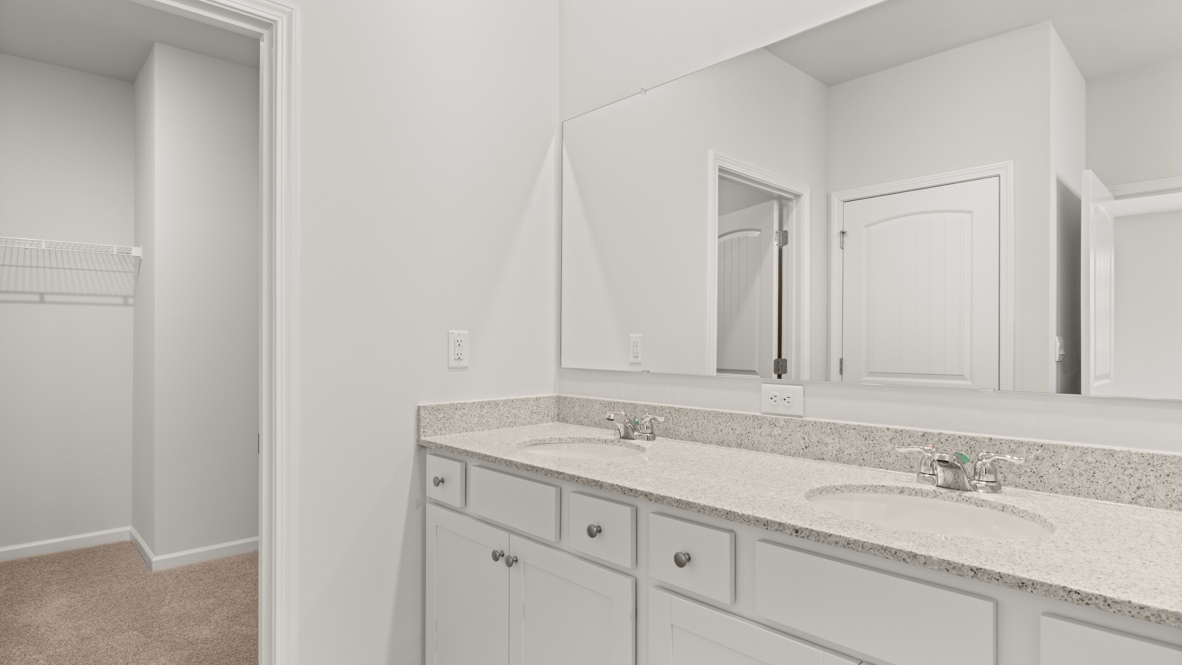 Interior primary bathroom with double sink