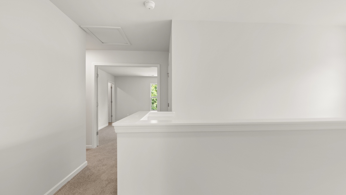 Interior upstairs loft area open to staircase