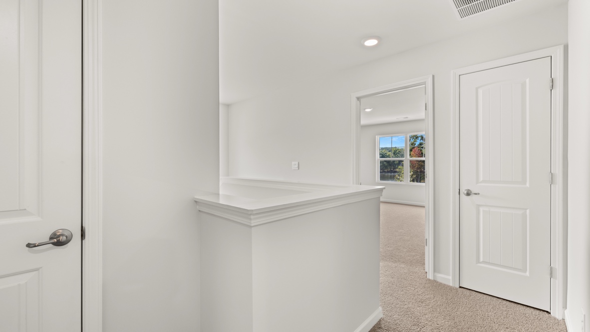 Interior upstairs loft area open to staircase