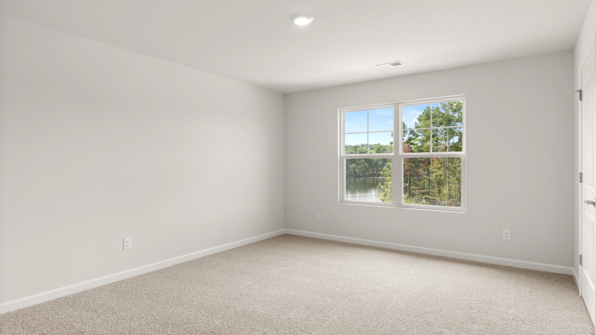 Interior upstairs bedroom with large window