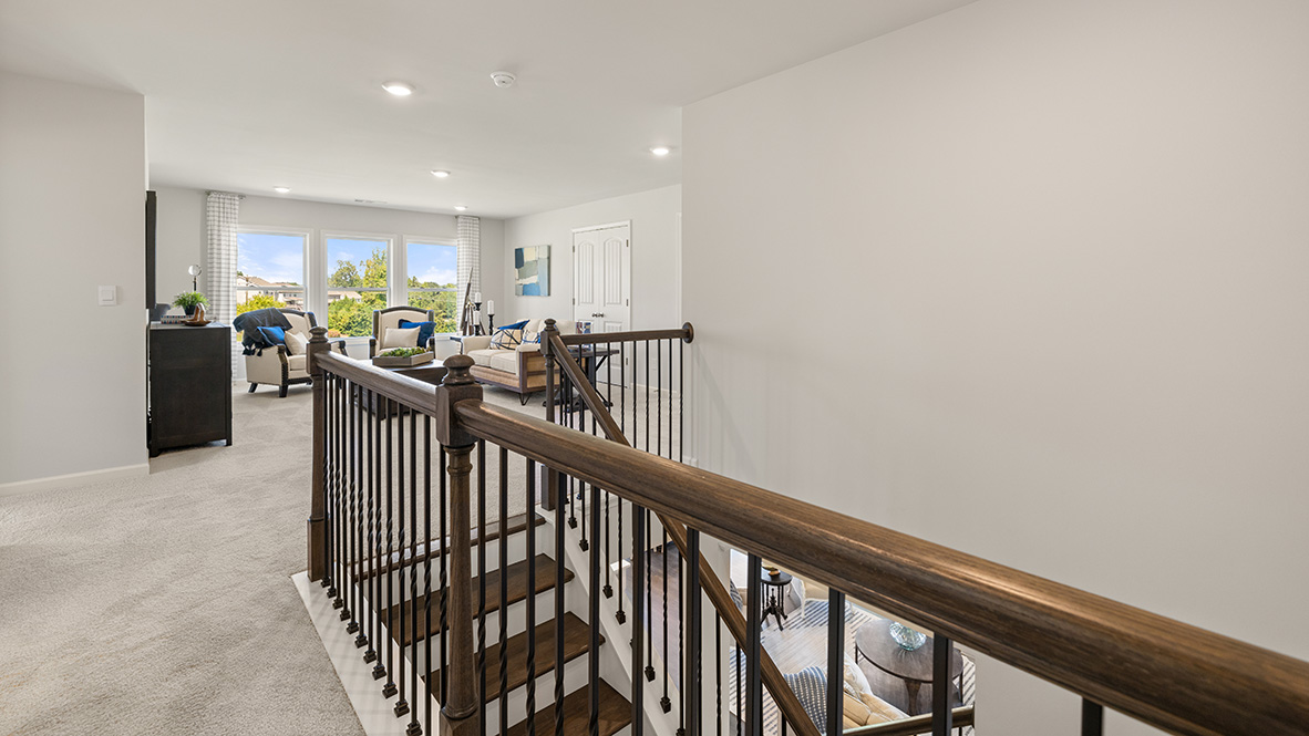 Interior upstairs loft area with large windows