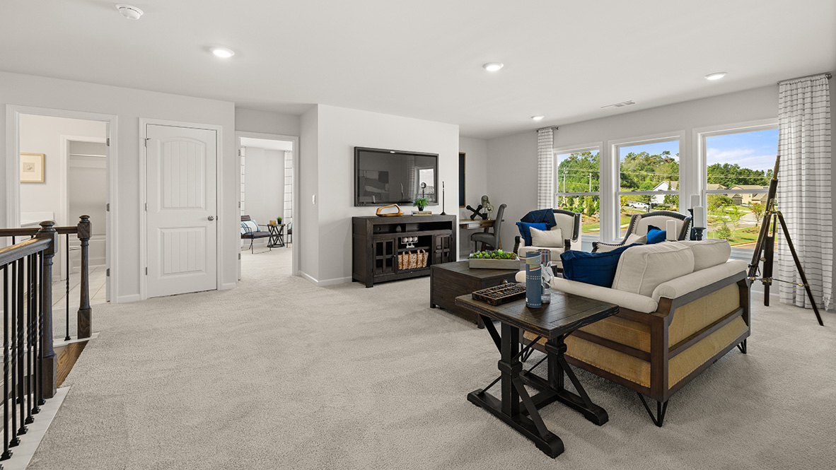 Interior upstairs loft area with large windows