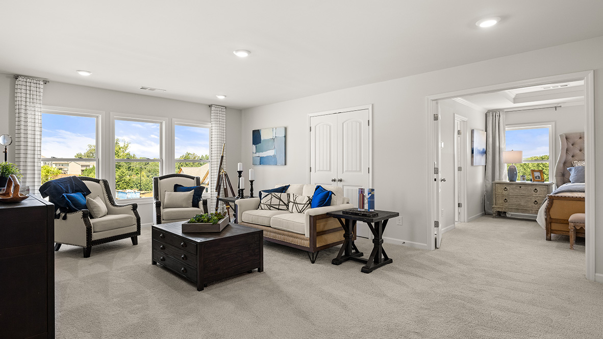 Interior upstairs loft area with large windows
