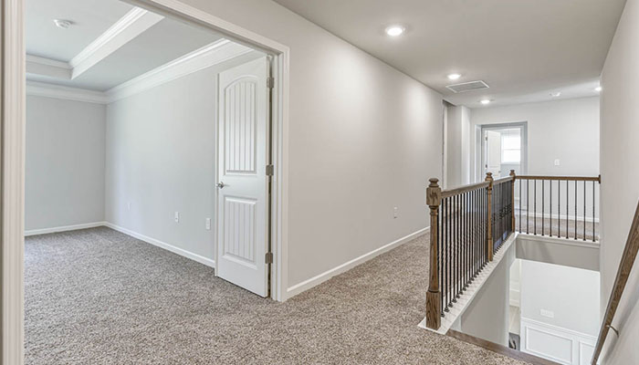 Interior upstairs loft area open to staircase