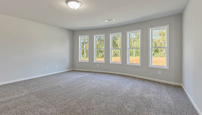 Interior flex room with large windows