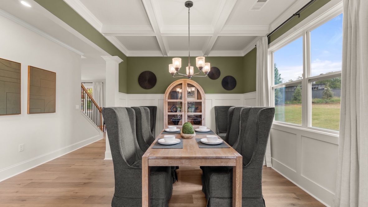 Interior dining area with large window and accent wall