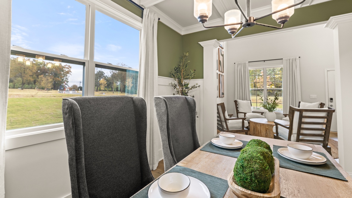 Interior dining area with large window and accent wall