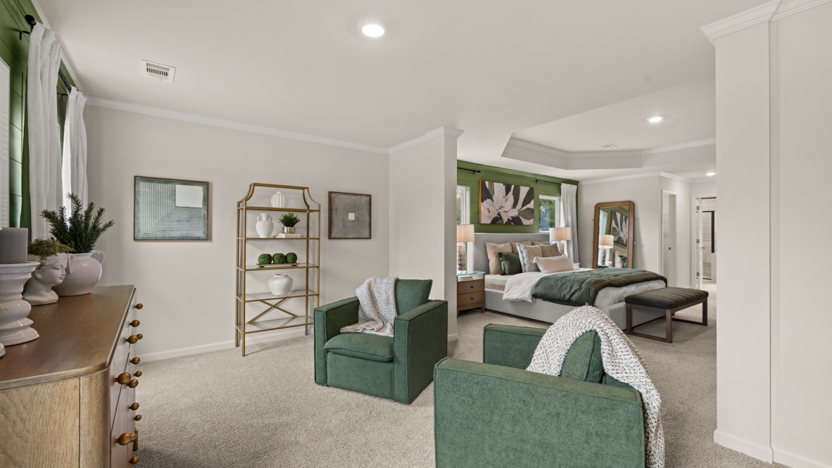 Interior primary bedroom with large windows and accent wall