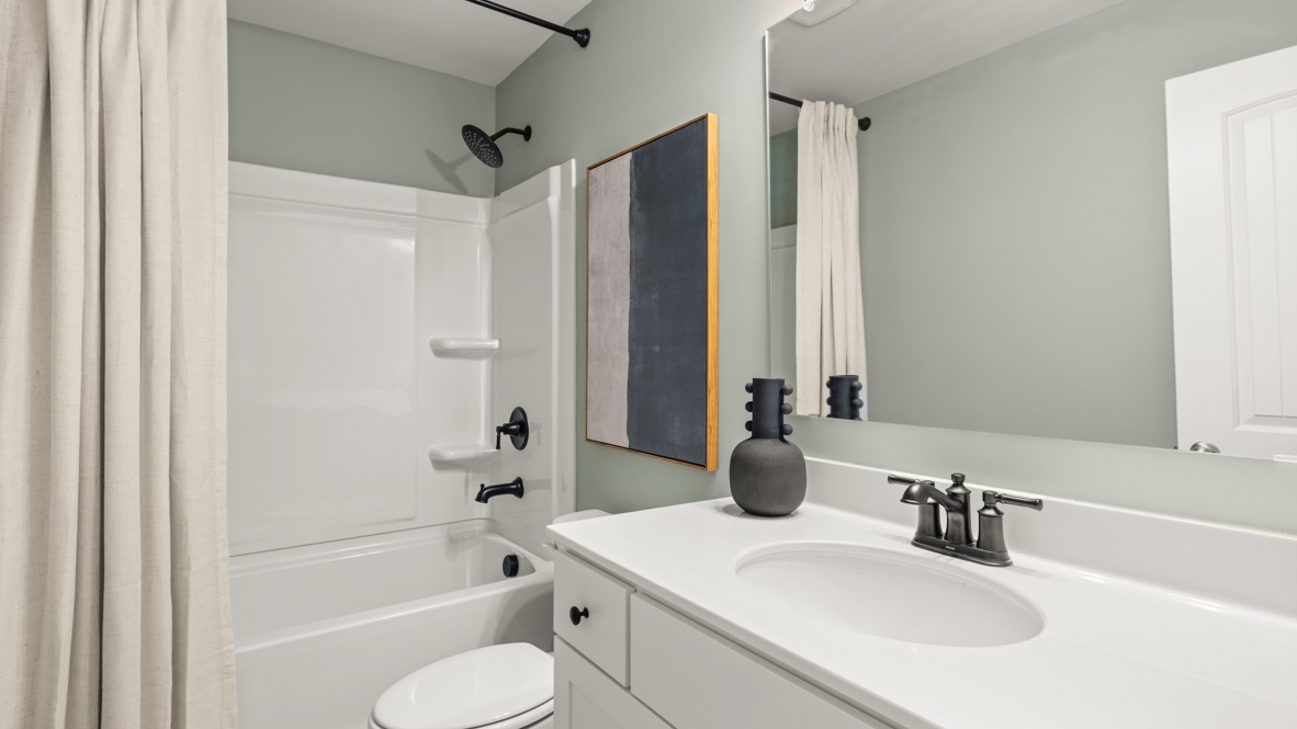 Interior bathroom with sink and full-sized shower