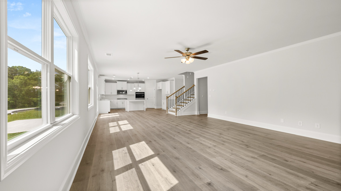 Interior living area with fire place and large windows