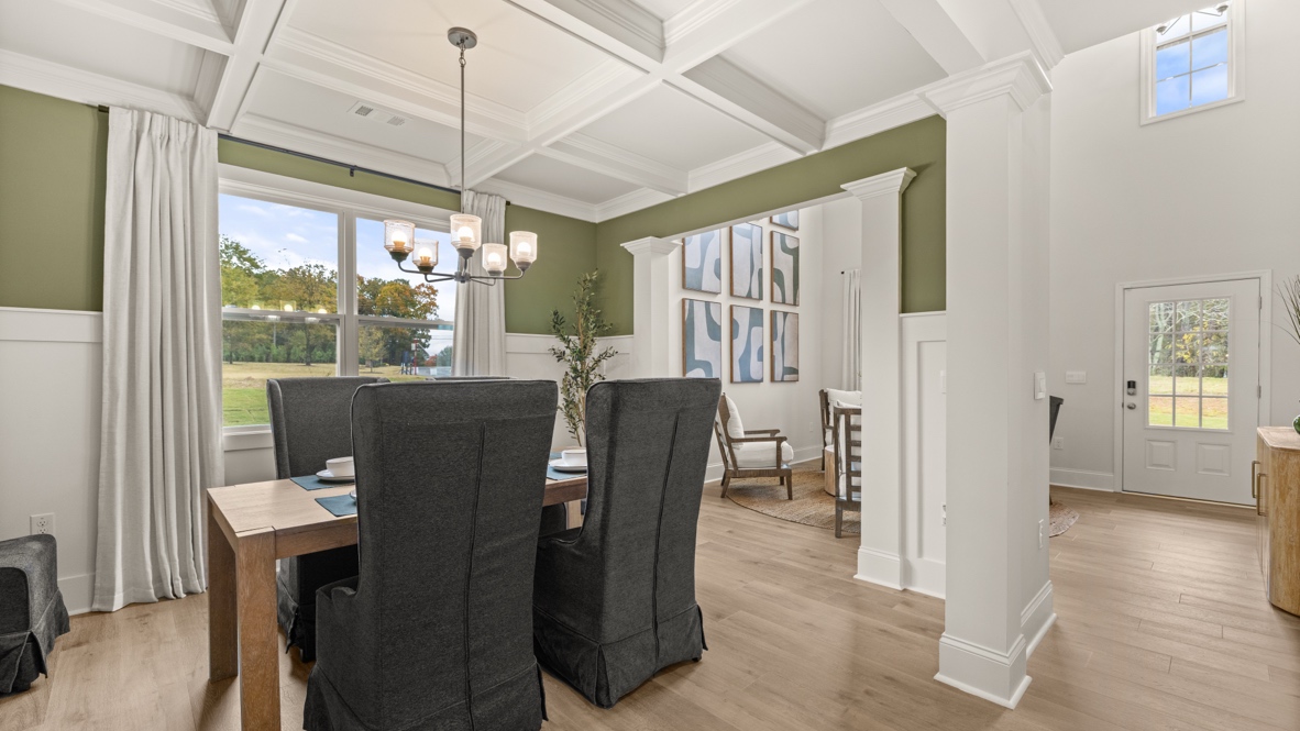 Interior dining area with large window and accent wall