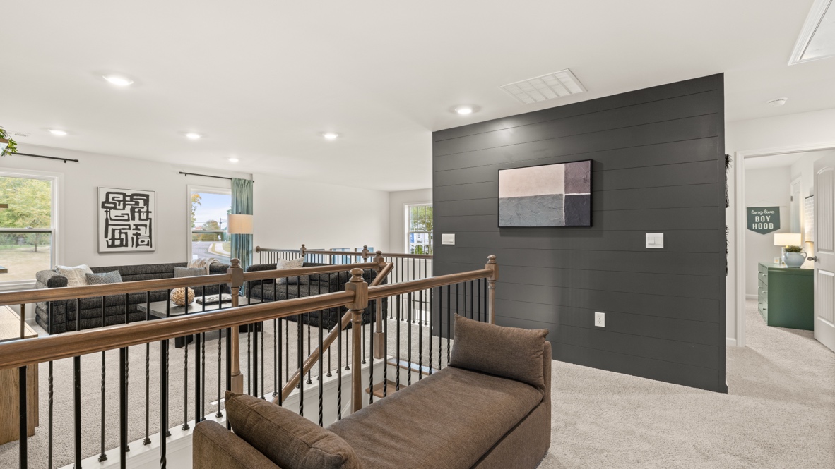 Interior upstairs loft area with accent wall