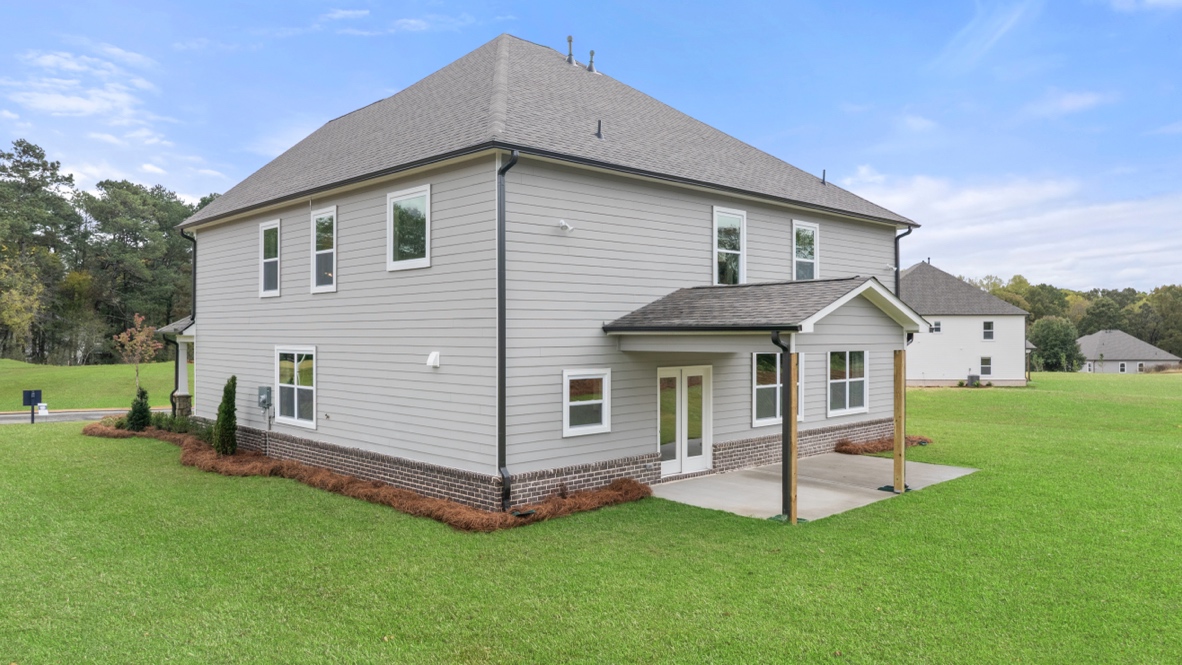 Exterior rear view of home with back patio