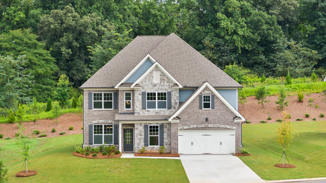 Exterior two-story home with stone detailing