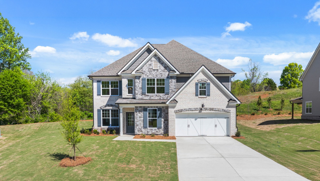 Exterior two-story home with stone detailing