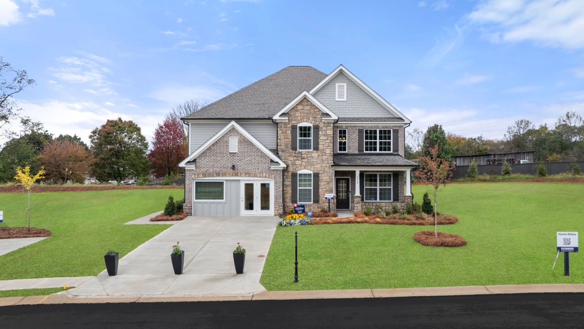 Exterior two-story home with stone detailing