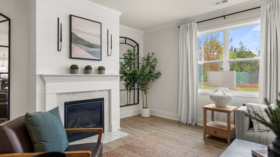 Interior living area with fire place and large window
