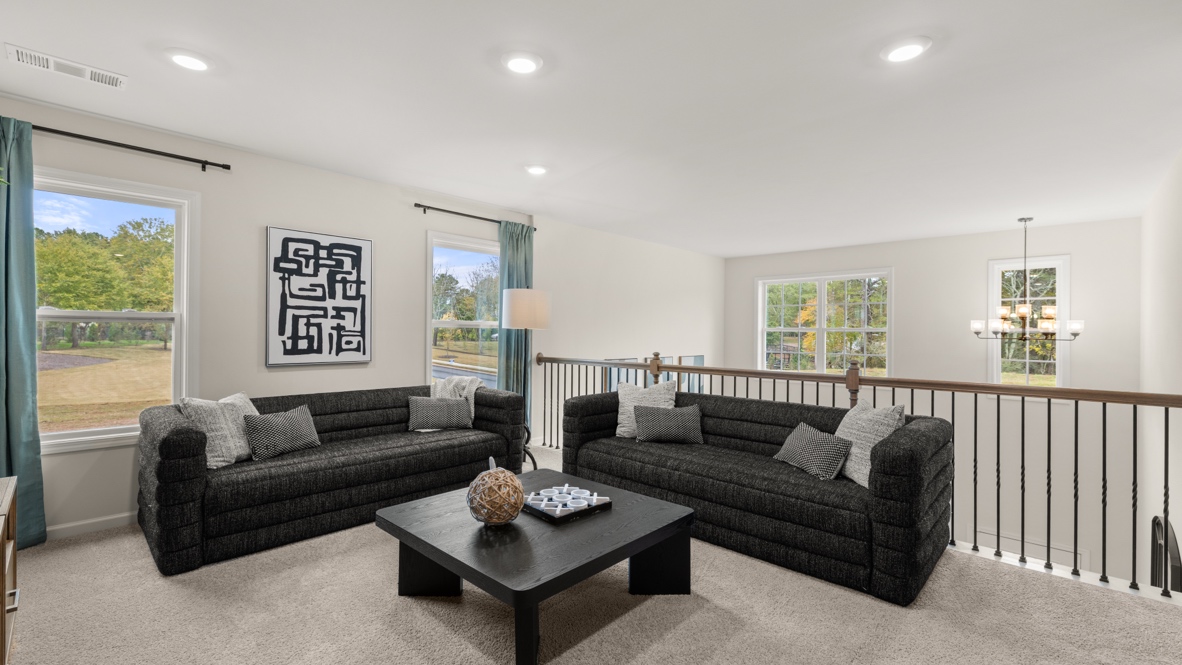 Interior upstairs loft area open to staircase