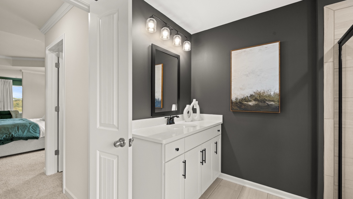 Interior primary bathroom with sink and shower