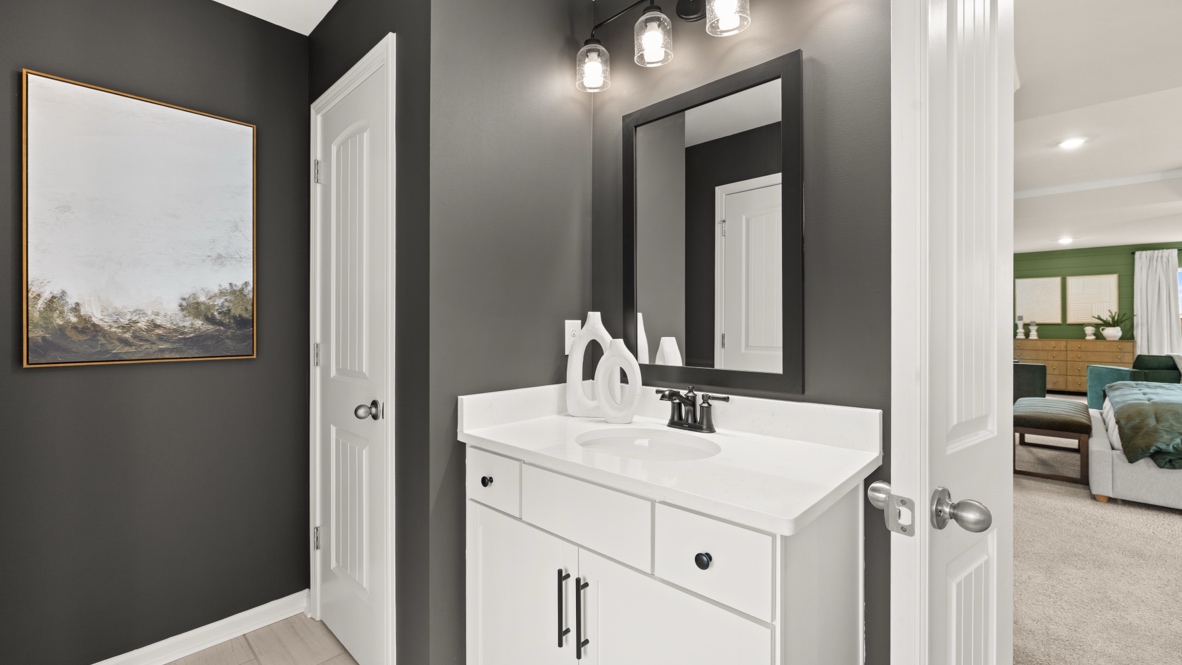 Interior primary bathroom with sink and shower