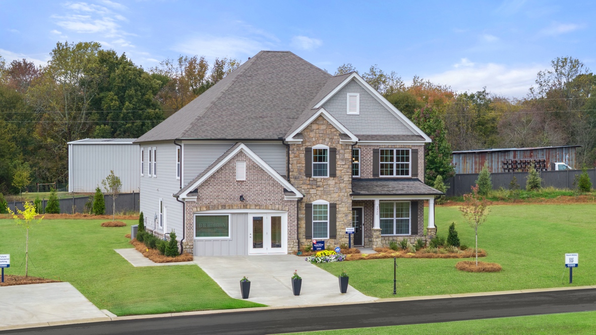 Exterior two-story home with stone detailing