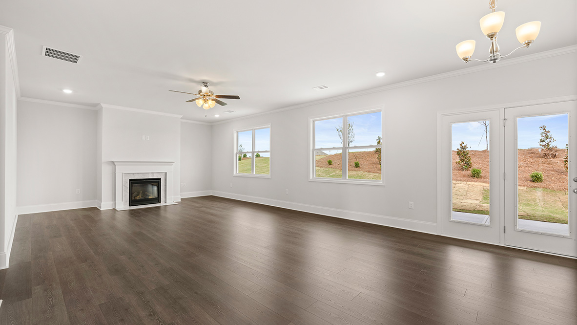Interior living area with fire place and large windows